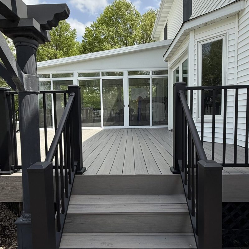 Deck Repair Services in St. Charles Worker performing Deck Repair Services in St. Charles, replacing damaged deck boards